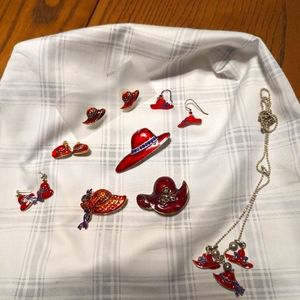 Red Hat . Earrings, brooches and necklace. Cosmetic jewelry.